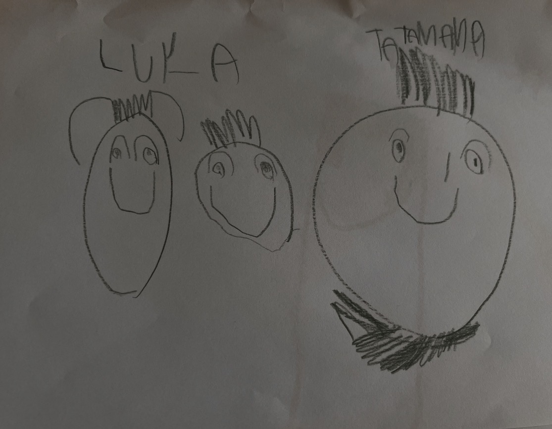 Pencil drawing of family portrait with three faces labeled Luka and Tatamama showing emotional awareness and family relationships in child art